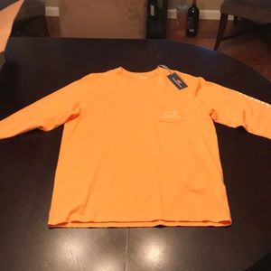 A lighter orange Vineyard Vines shirt NEVER USED